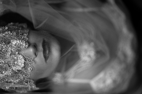 Beautiful Bride in artistic mask and veil for her Boudoir Album for her wedding Gift